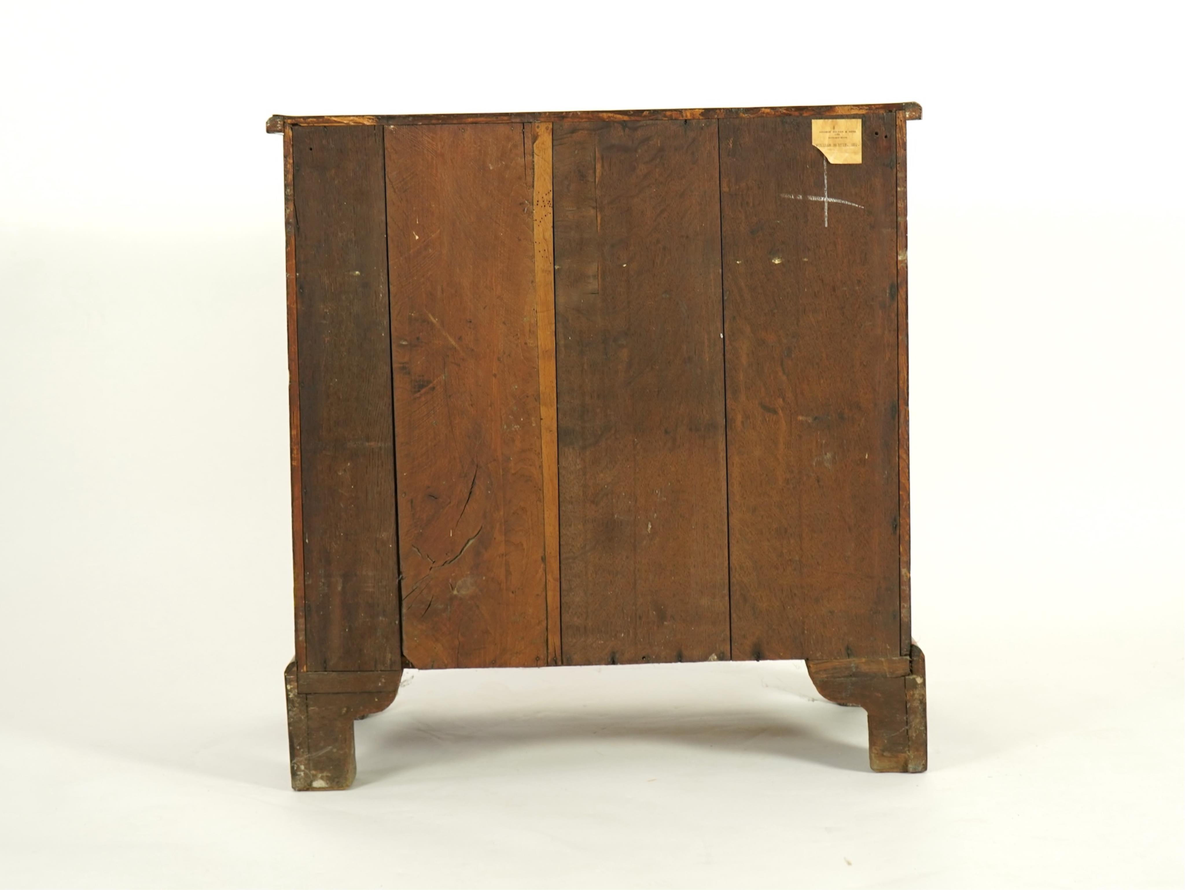 A small early 18th century and later cross and feather banded walnut veneered chest
